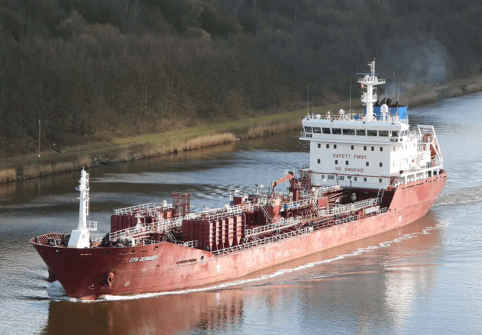 M/T GTM Denmark moving through calm water with full forward profile — 11,393 DWT tanker in cargo operation.
