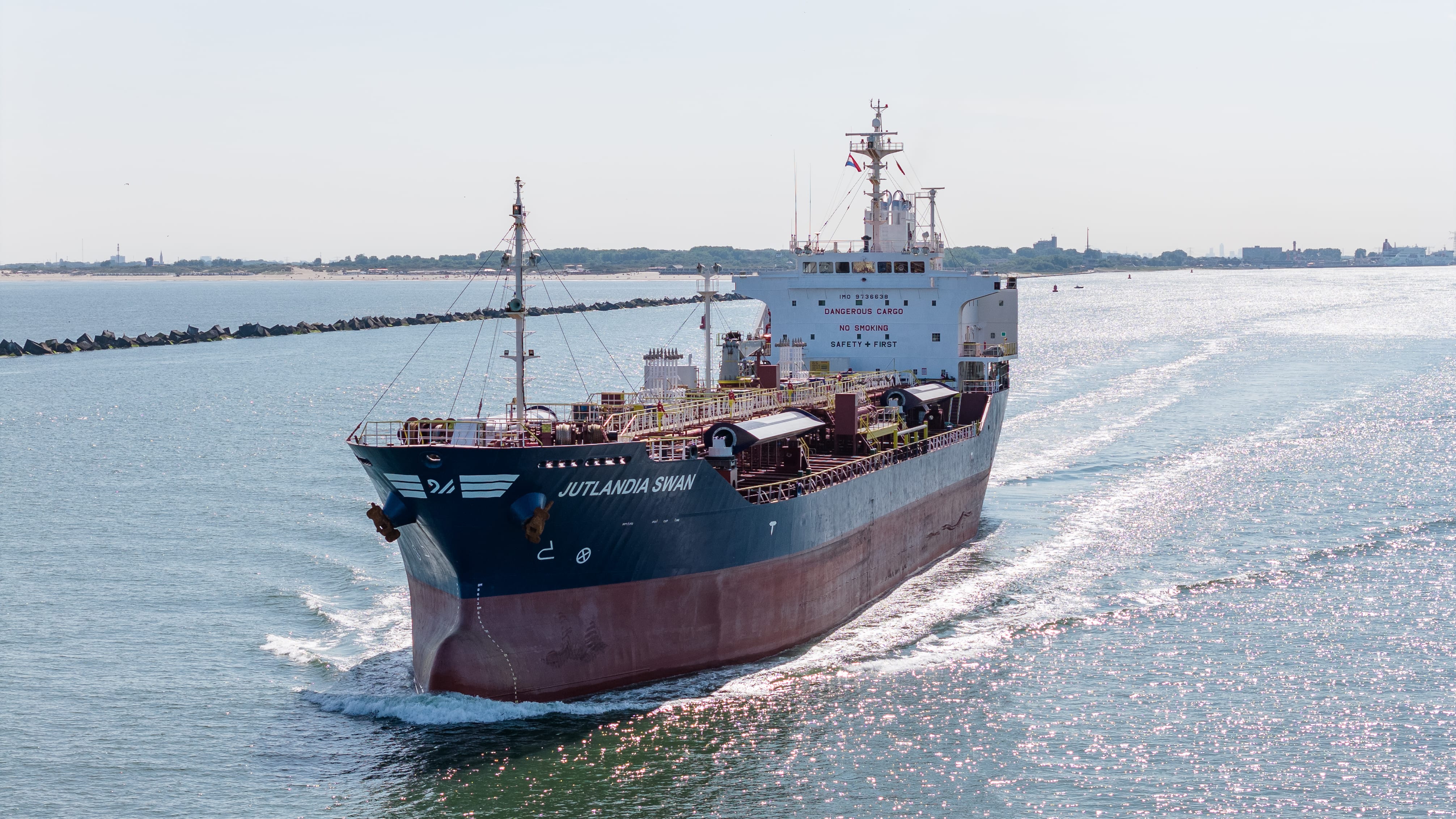 M/T Jutlandia Swan, 12,479 DWT stainless steel chemical tanker, sailing starboard view — moving liquid cargo.